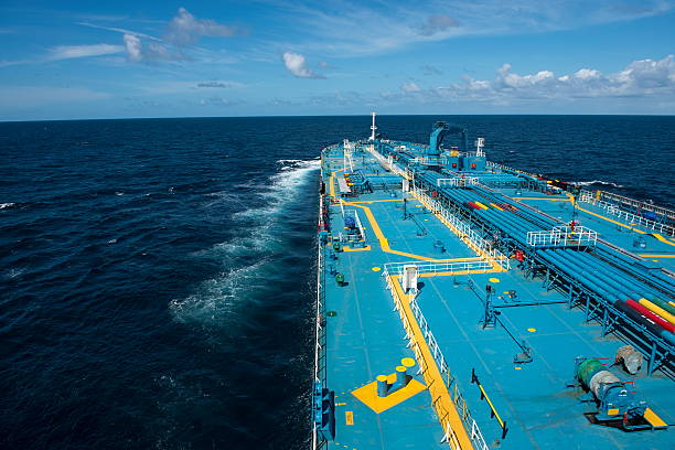 Tanker traveling on the open ocean Close view of the supertanker's deck. oil tanker stock pictures, royalty-free photos & images