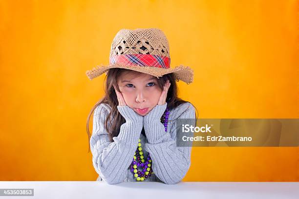 Girl With Hat Gray Sweater Necklaces And Looking Bored Stock Photo - Download Image Now