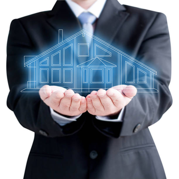 istock Businessman  Holding Virtual  House 453504227