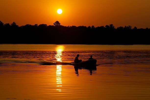 istock Couple Taking a Boat Ride Under the Sunset 453510329