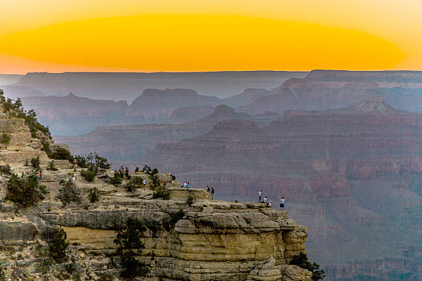 People watching Colorful Sunset at the Great Canyon People watching Colorful Sunset at the Great Canyon seen from Maters Point yaki point stock pictures, royalty-free photos & images