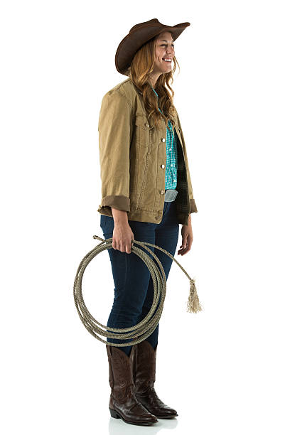 istock Happy cowgirl standing 453510539