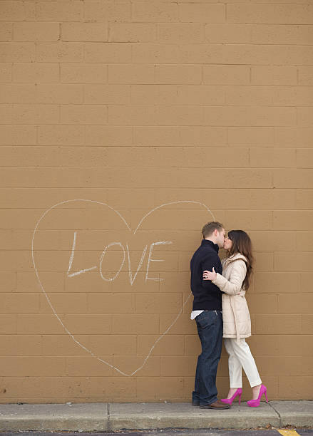 istock Young Couple Kissing Outside 453510935