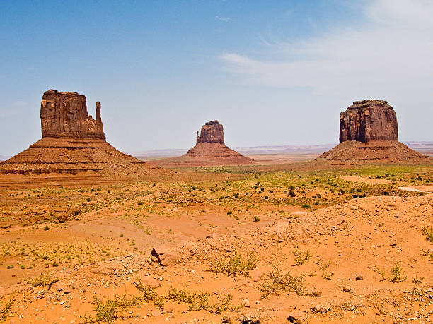 Mittens and Merric Butte  are giant sandstone formations Mittens and Merric Butte  are giant sandstone formation in the Monument valley david merrick photos stock pictures, royalty-free photos & images
