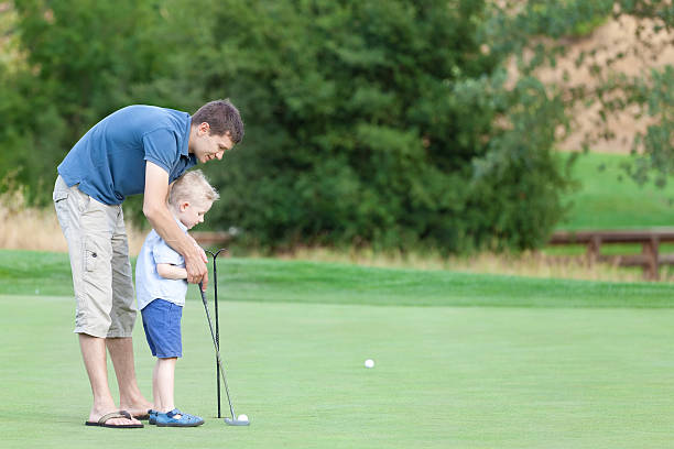 istock family of two at the golf course 453512199