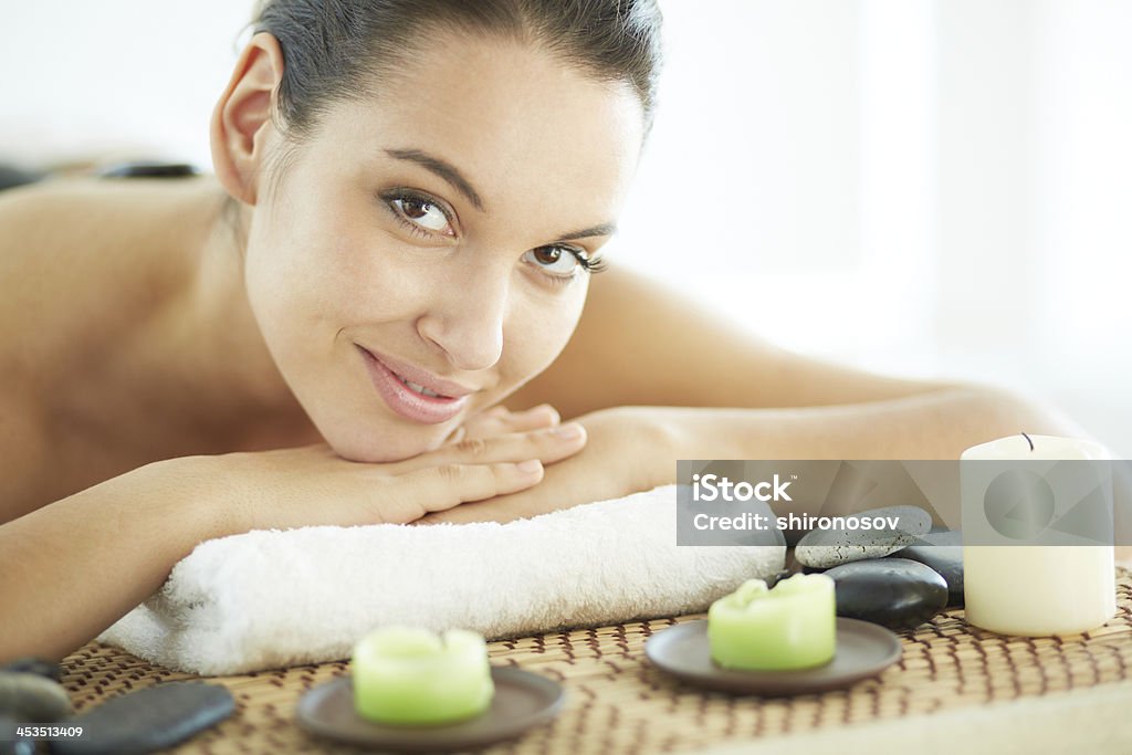 Pleasant procedure Portrait of young female ready for massage looking at camera Adult Stock Photo