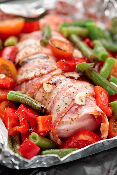 istock Chicken breast wrapped in bacon prior to baking 453514127