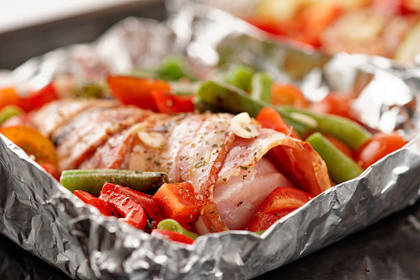 istock Chicken breast wrapped in bacon prior to baking 453514753
