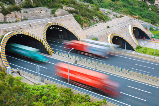 highway tunnel and container truck motion blur