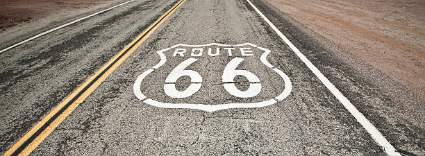 route 66 ペインティッドに road の砂漠 - desert road road highway california ストックフォトと画像