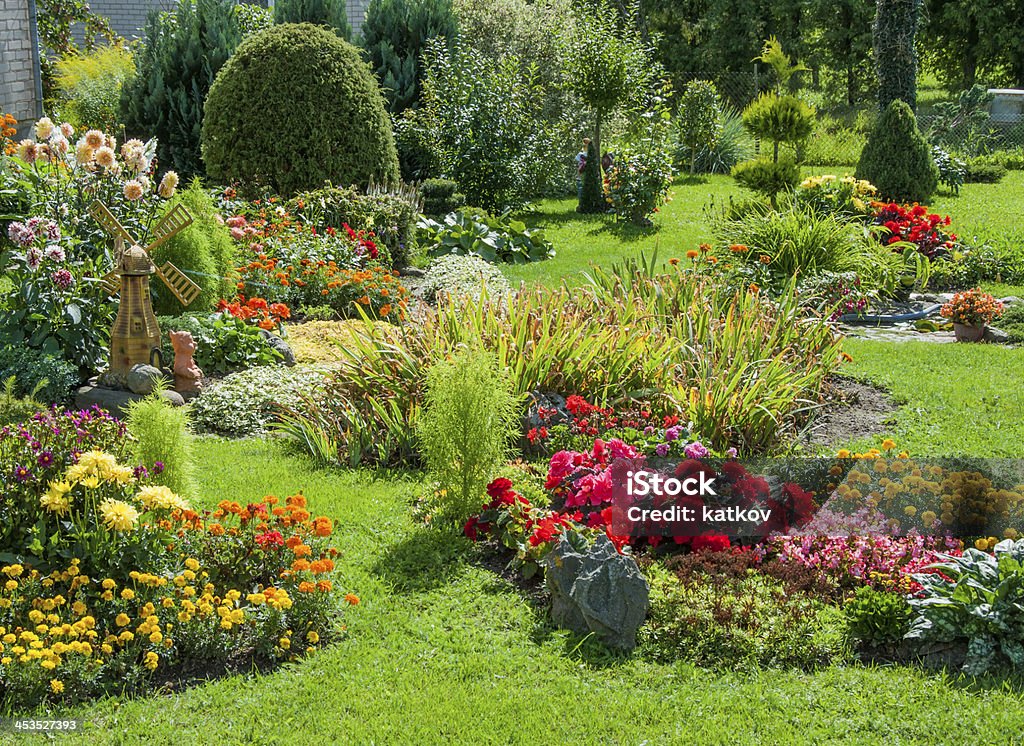 Landscaped flower garden Beautiful flower garden with blooming seasonal flowers Landscaped Stock Photo