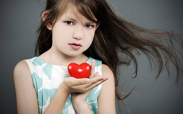 istock little girl with a heart 453528109