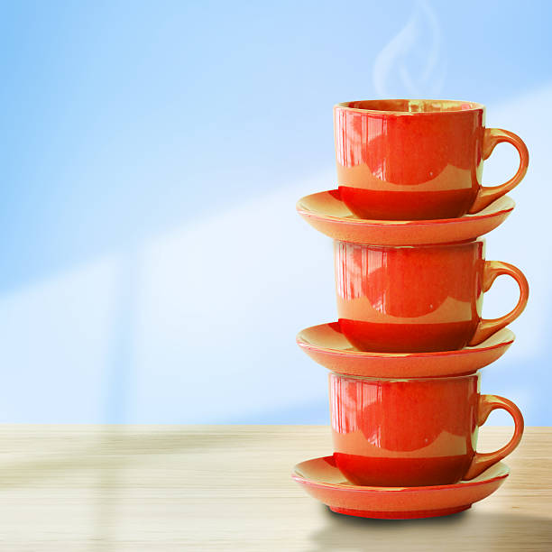 istock Colorful coffee cups on wooden table 453529205