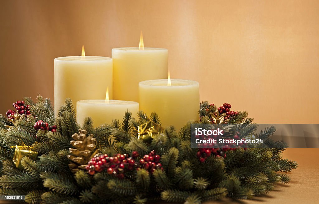 Advent wreath Advent wreath with burning candles for the pre Christmas time Candle Stock Photo