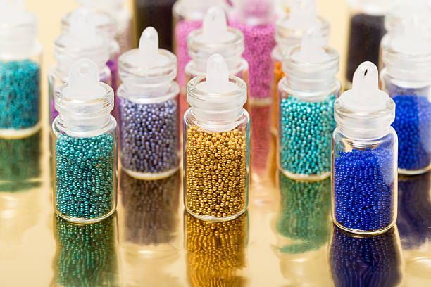 istock Small Glass Jars filled with Balls of Bead 453535449
