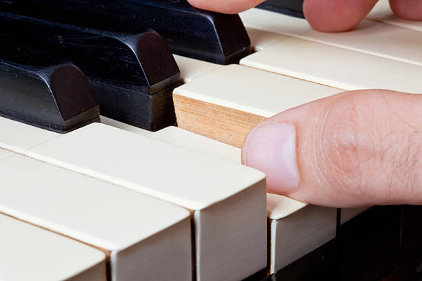 istock Piano keyboard made of ivory with hands 453539543
