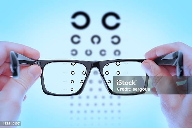 Checking Vision On The Table Golovin Stock Photo - Download Image Now - Eyeglasses, Eye Chart, Defocused