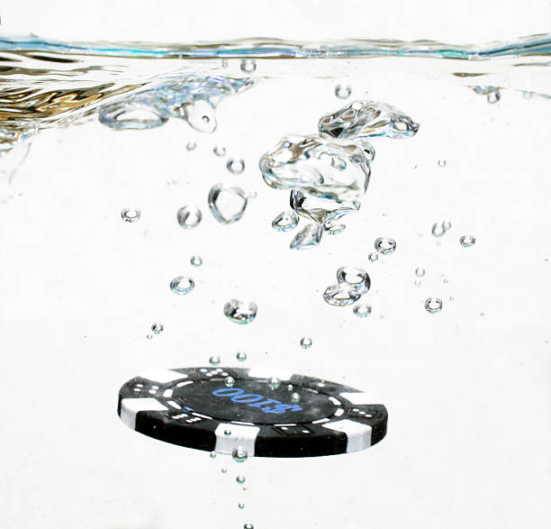 istock Casino chip hits the water 453542191