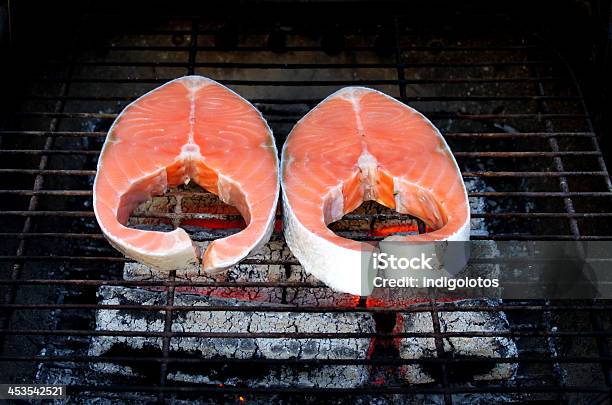 Two Fresh Salmon Steaks On Bbq Stock Photo - Download Image Now - Cooking, Cutting, Dinner