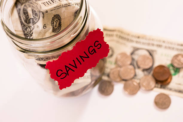 istock Consumerism:  Money Jar with U.S. currency.  Saving for the future. 453542545