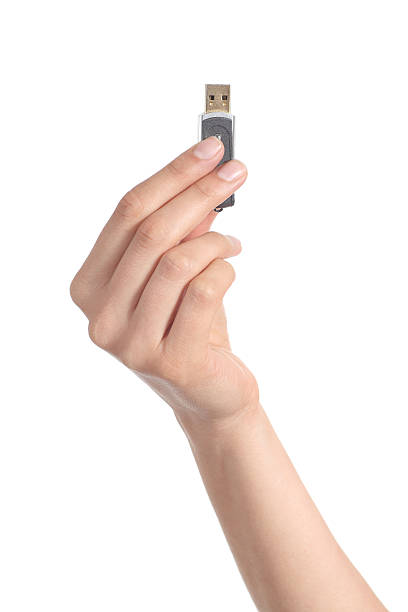 istock Woman hand holding up a flash drive 453549719
