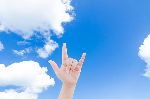 istock woman hand over clear sky 453550219