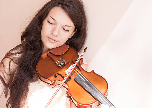 Violin player classical musician violinist playing musical instrument