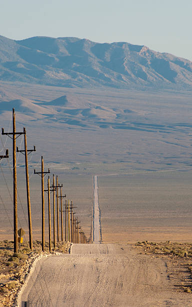 istock wooden electric's pylons on the road 453550981