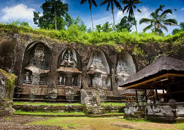 Gunung Kawi is a temple complex centered around royal tombs carved into stone cliffs in the 11th century. It is located amid scenic rice terraces about 30 minutes from Ubud.