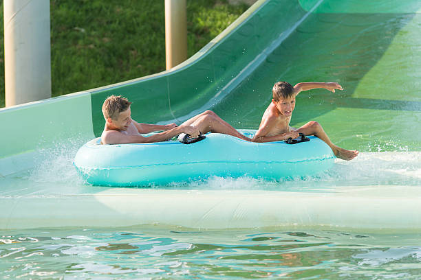 istock boys in aquapark 453562343