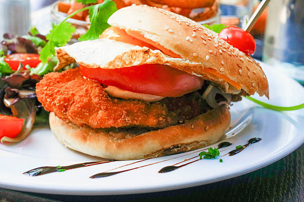istock American cheese chicken burger with fresh salad 453562345