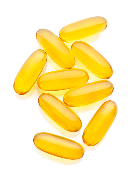 omega 3 - cod liver oil fish oil vitamin e vitamin pill stock-fotos und bilder