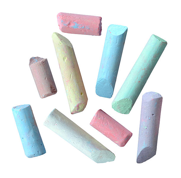 Isolated colorful pieces of grungy broken chalk stock photo