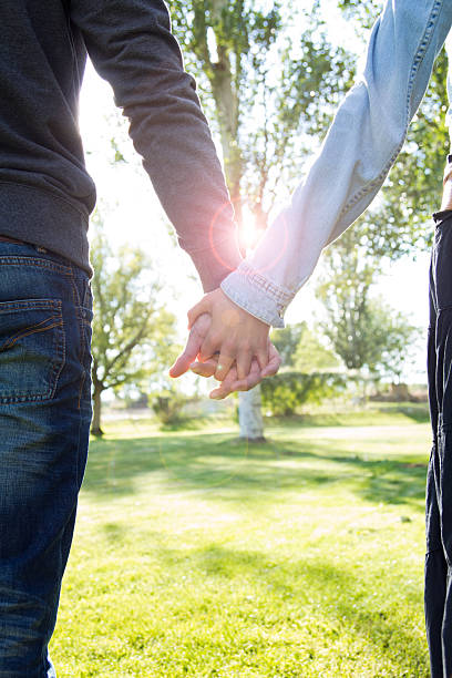 istock hands of a couple held together 453571285