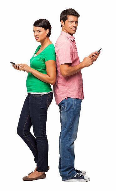 istock Couple Communicating Through Smart Phones - Isolated 453573451