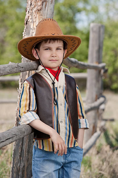 istock Cowboy at an old fence 453574011