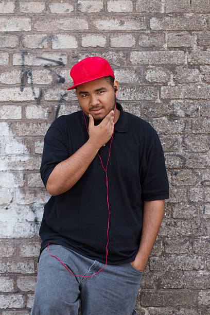 istock Black guy in headphones on the corner 453576489