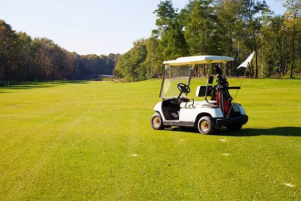 Golf-cart car on golf course landscape