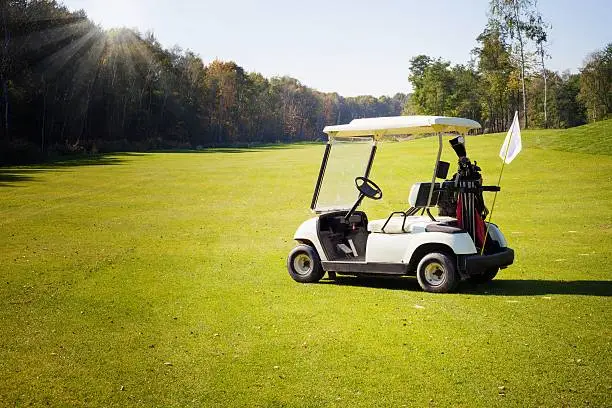 Golf-cart car on golf course landscape