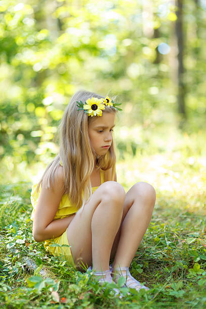 istock Little sad girl in the forest 453580629