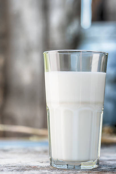 Fresh glass of Milk. Pastel toned picture with a selective focus. 