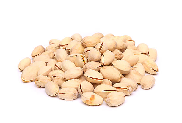 istock pistachios heap on the white background close-up 453583689