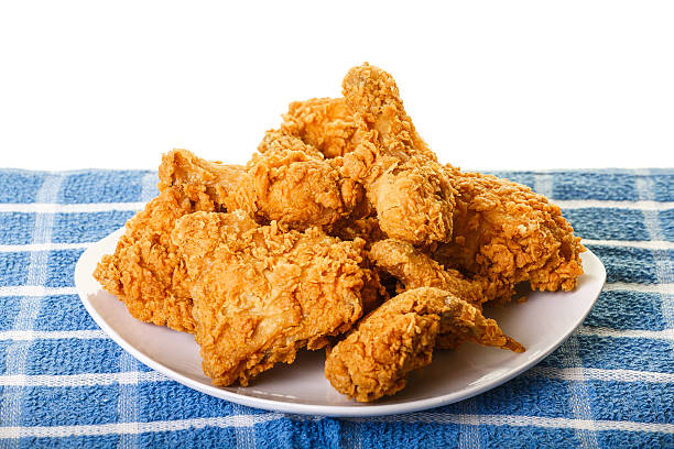 Golden Fried Chicken on Plate and Placemat stock photo
