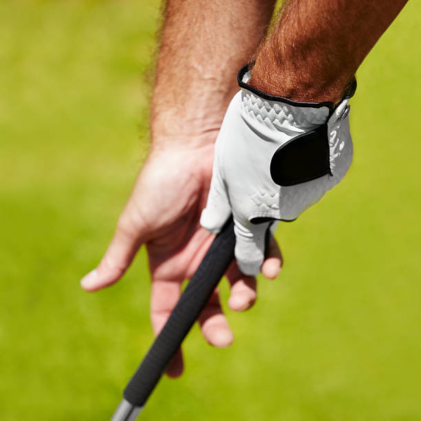 The proper grip is important Cropped image of a golfer demonstrating the proper grip golf glove stock pictures, royalty-free photos & images