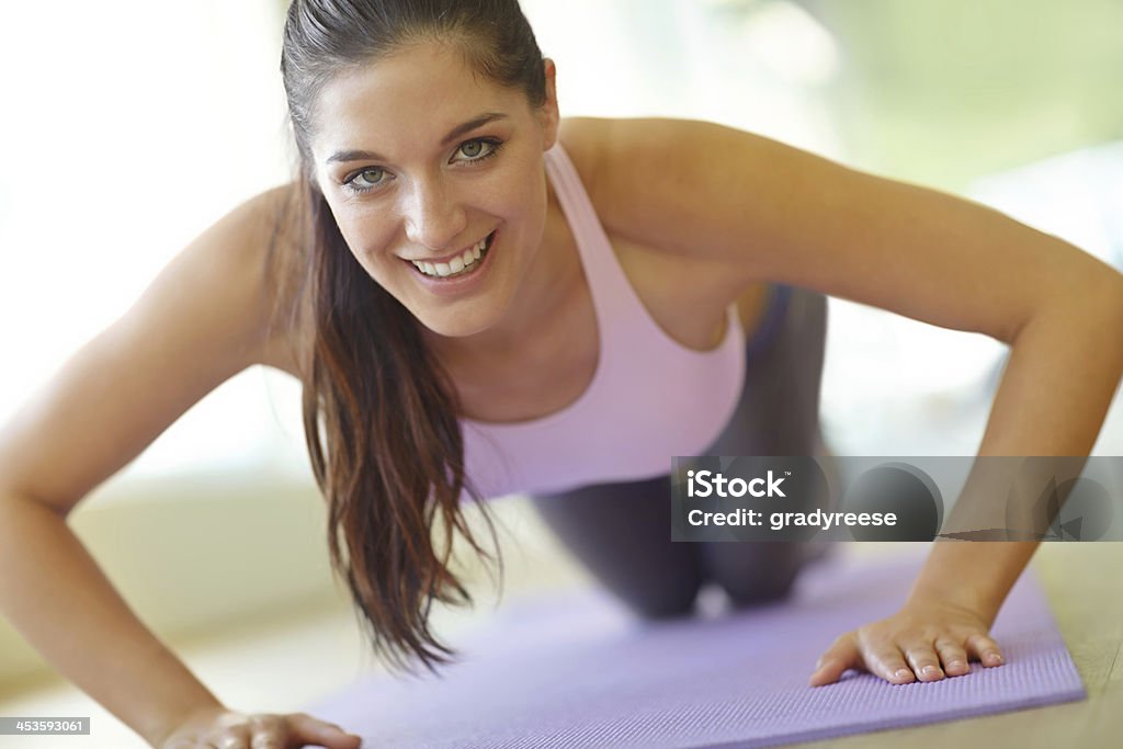 How many is that now? A beautiful young woman doing push-ups 20-24 Years Stock Photo