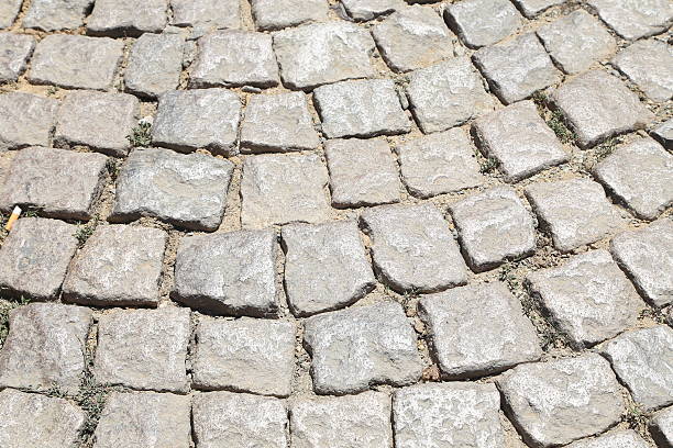 istock Stone road texture. Cobblestones. Close-up. 453593359