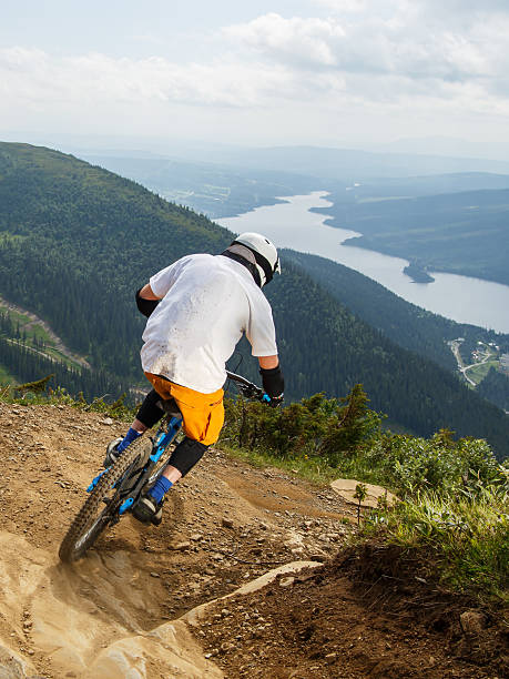 istock Downhill mountain biker making a turn on rocky trail 453595125
