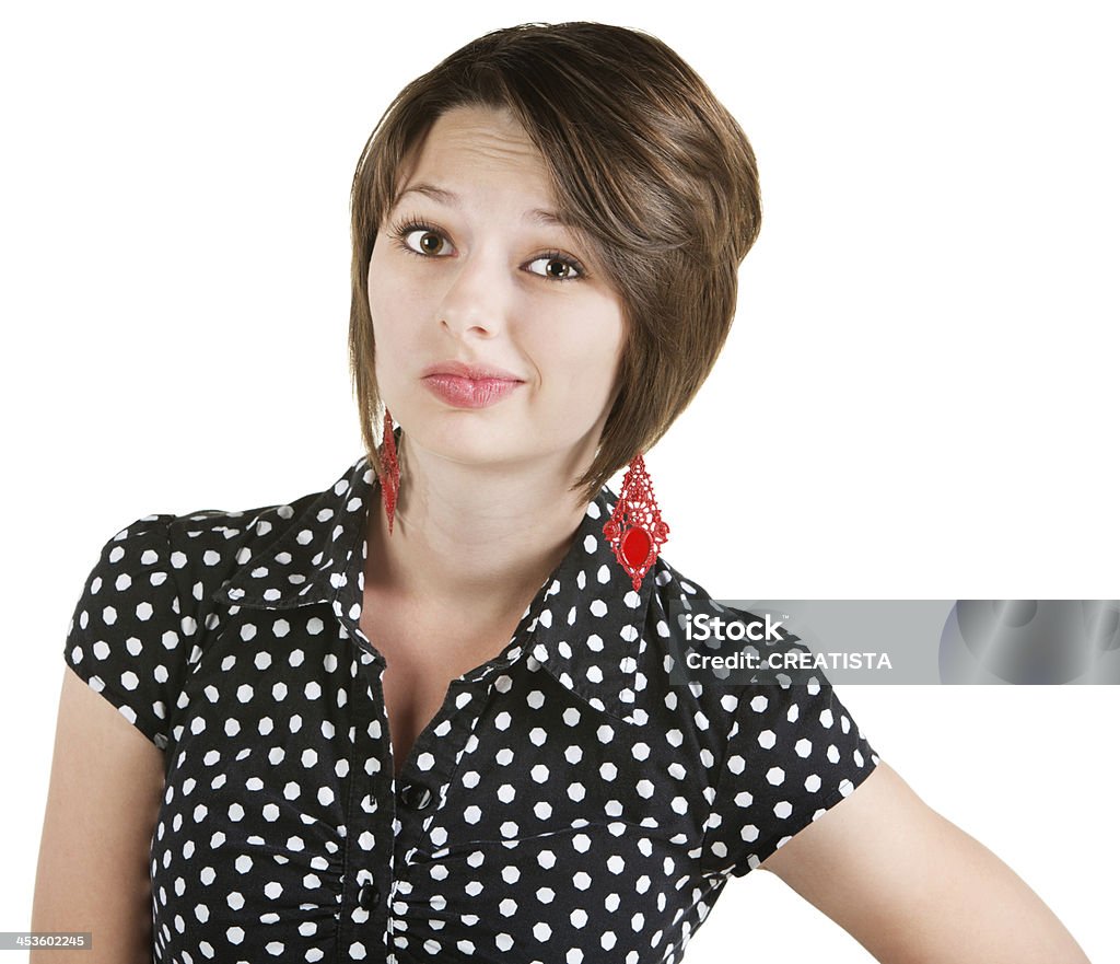 Unimpressed White Female Unimpressed young white female in polka dot blouse Adult Stock Photo