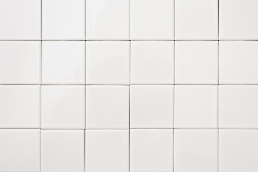 Close-up of white tile background.