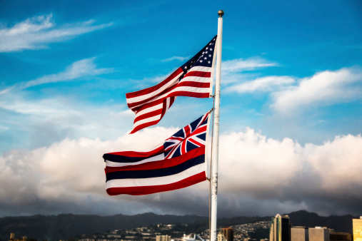 American Flag and Hawaii State flag waving in the wind